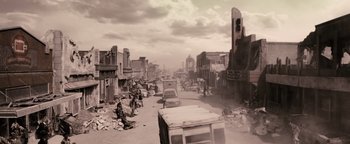 Movie still from “The Book of Eli” (2010), directed by Allen Hughes – An old photo of a city with a lot of trash everywhere; Extreme Wide shot, High angle