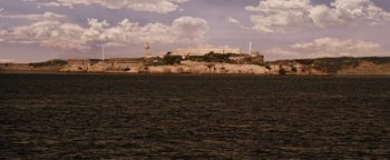 Movie still from “The Book of Eli” (2010), directed by Allen Hughes – A view of a large building on top of a hill; Extreme Wide shot, High angle