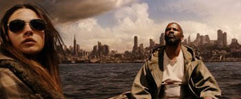 Movie still from “The Book of Eli” (2010), directed by Allen Hughes – A man standing in front of a body of water; Close Up shot, High angle