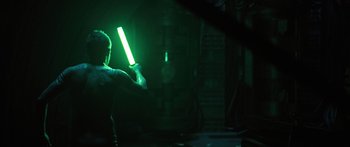 Movie still from “Pandorum” (2009), directed by Christian Alvart – A man holding a baseball bat in the dark; Medium shot, Over the shoulder angle