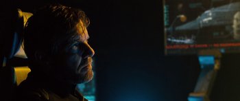 Movie still from “Pandorum” (2009), directed by Christian Alvart – A person with a beard; Close Up shot, Over the shoulder angle