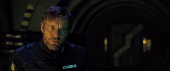 Movie still from “Pandorum” (2009), directed by Christian Alvart – A person wearing a motorcycle jacket; Close Up shot, Low angle
