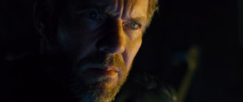 Movie still from “Pandorum” (2009), directed by Christian Alvart – A man's face in the dark; Close Up shot, Low angle