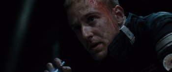 Movie still from “Pandorum” (2009), directed by Christian Alvart – A person holding a cell phone; Close Up shot, Low angle