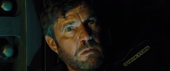 Movie still from “Pandorum” (2009), directed by Christian Alvart – A person with green eyes; Close Up shot, Low angle