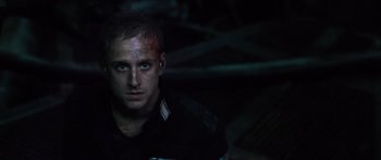 Movie still from “Pandorum” (2009), directed by Christian Alvart – A person wearing a black shirt; Close Up shot, Low angle