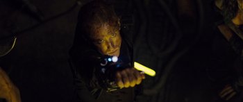 Movie still from “Pandorum” (2009), directed by Christian Alvart – A man holding a flashlight in the dark; Close Up shot, Low angle