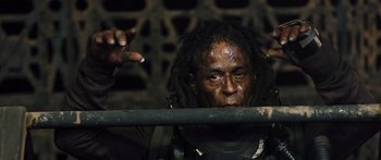 Movie still from “Pandorum” (2009), directed by Christian Alvart – A person holding a stick; Close Up shot, Low angle