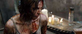 Movie still from “Pandorum” (2009), directed by Christian Alvart – A woman with blood all over her face; Close Up shot, High angle