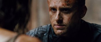 Movie still from “Pandorum” (2009), directed by Christian Alvart – A person with makeup on; Close Up shot, Over the shoulder angle