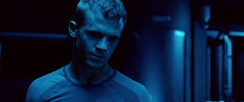 Movie still from “Pandorum” (2009), directed by Christian Alvart – A person wearing a shirt; Close Up shot, Over the shoulder angle