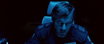 Movie still from “Pandorum” (2009), directed by Christian Alvart – A person sitting in a chair; Close Up shot, Low angle