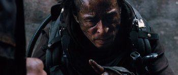 Movie still from “Pandorum” (2009), directed by Christian Alvart – A person with a face covered in dirt; Close Up shot, High angle