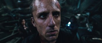 Movie still from “Pandorum” (2009), directed by Christian Alvart – A person with dirt on his face; Close Up shot, Low angle