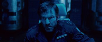 Movie still from “Pandorum” (2009), directed by Christian Alvart – A person sitting in a chair; Close Up shot, Low angle