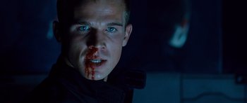 Movie still from “Pandorum” (2009), directed by Christian Alvart – A person with blood on his face; Close Up shot, Low angle