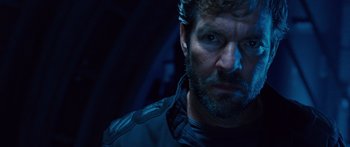 Movie still from “Pandorum” (2009), directed by Christian Alvart – A person with a beard; Close Up shot, Over the shoulder angle