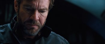 Movie still from “Pandorum” (2009), directed by Christian Alvart – A person with a cell phone; Close Up shot, Over the shoulder angle