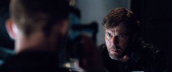 Movie still from “Pandorum” (2009), directed by Christian Alvart – A man is taking a picture of another man; Close Up shot, Over the shoulder angle