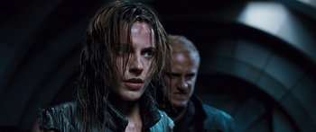 Movie still from “Pandorum” (2009), directed by Christian Alvart – A man and a woman with wet hair; Close Up shot, Over the shoulder angle