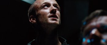 Movie still from “Pandorum” (2009), directed by Christian Alvart – A person looking up at the sky; Close Up shot, Low angle