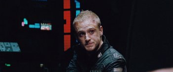 Movie still from “Pandorum” (2009), directed by Christian Alvart – A person wearing a motorcycle jacket; Close Up shot, Low angle