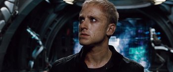 Movie still from “Pandorum” (2009), directed by Christian Alvart – A person wearing a black shirt; Close Up shot, Low angle