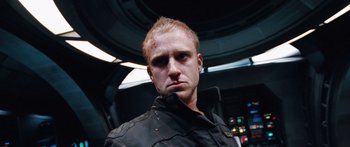 Movie still from “Pandorum” (2009), directed by Christian Alvart – A person wearing a jacket; Close Up shot, Low angle