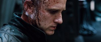 Movie still from “Pandorum” (2009), directed by Christian Alvart – A person with blood all over his face; Close Up shot, Low angle
