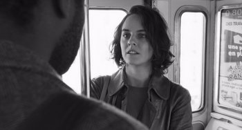 Movie still from “Paris, 13th District” (2021), directed by Jacques Audiard – Black and white photograph of a woman looking into a mirror; Close Up shot, Over the shoulder angle