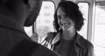 Movie still from “Paris, 13th District” (2021), directed by Jacques Audiard – A man and a woman are talking on a bus; Close Up shot, Over the shoulder angle