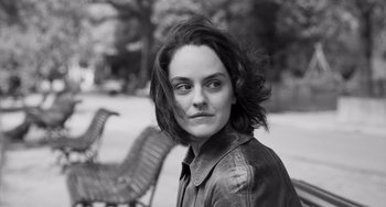 Movie still from “Paris, 13th District” (2021), directed by Jacques Audiard – Black and white photograph of a woman in a leather jacket; Close Up shot, Low angle