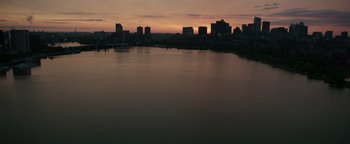 Movie still from “Patriots Day” (2016), directed by Peter Berg – A view of a large body of water and a city skyline; Extreme Wide shot, High angle