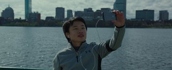 Movie still from “Patriots Day” (2016), directed by Peter Berg – A man taking a picture of himself with his cell phone; Close Up shot, High angle