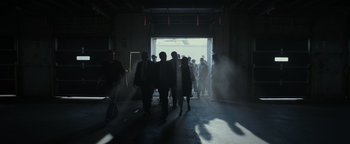 Movie still from “Patriots Day” (2016), directed by Peter Berg – A group of people walking through a doorway; Wide shot, Low angle