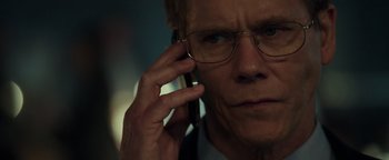 Movie still from “Patriots Day” (2016), directed by Peter Berg – A person talking on a cell phone; Close Up shot, Over the shoulder angle