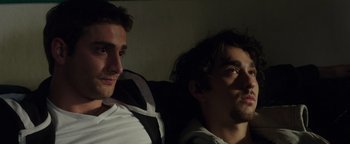 Movie still from “Patriots Day” (2016), directed by Peter Berg – Two men sitting next to each other in a dark room; Close Up shot, Low angle
