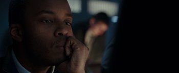 Movie still from “Patriots Day” (2016), directed by Peter Berg – A person holding his hand to his face; Close Up shot, Over the shoulder angle