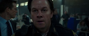 Movie still from “Patriots Day” (2016), directed by Peter Berg – A person wearing a jacket; Close Up shot, Low angle