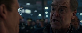 Movie still from “Patriots Day” (2016), directed by Peter Berg – An older man is looking into the distance; Close Up shot, Over the shoulder angle