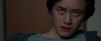 Movie still from “Patriots Day” (2016), directed by Peter Berg – A person's face with a sad look; Close Up shot, Low angle