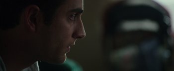 Movie still from “Patriots Day” (2016), directed by Peter Berg – A man's face in a dark room; Close Up shot, Over the shoulder angle
