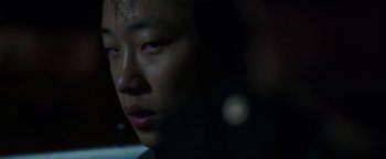 Movie still from “Patriots Day” (2016), directed by Peter Berg – A person's face in the dark; Close Up shot, Over the shoulder angle