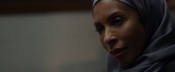 Movie still from “Patriots Day” (2016), directed by Peter Berg – A person wearing a headscarf; Close Up shot, Over the shoulder angle
