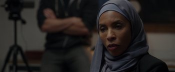 Movie still from “Patriots Day” (2016), directed by Peter Berg – A person wearing a headscarf; Close Up shot, Over the shoulder angle