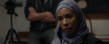 Movie still from “Patriots Day” (2016), directed by Peter Berg – A person wearing a headscarf; Close Up shot, Over the shoulder angle