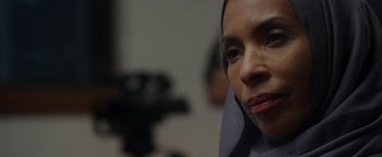 Movie still from “Patriots Day” (2016), directed by Peter Berg – A person wearing a headscarf; Close Up shot, Over the shoulder angle