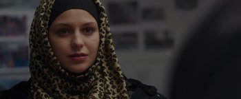 Movie still from “Patriots Day” (2016), directed by Peter Berg – A person wearing a headscarf; Close Up shot, Over the shoulder angle