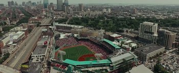 Movie still from “Patriots Day” (2016), directed by Peter Berg – An aerial view of a baseball game in a large city; Extreme Wide shot, High angle