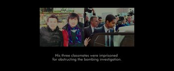 Movie still from “Patriots Day” (2016), directed by Peter Berg – A group of people standing next to each other on a street; Medium shot, Overhead angle